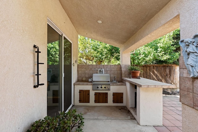 10597 E Fieldstone Ave, Clovis, CA 93619 - view of patio / terrace featuring grilling area, area for grilling, fence, and a sink