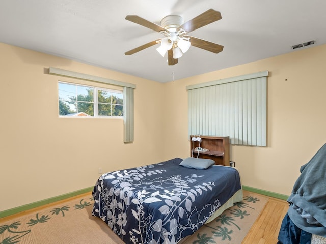 4740 E Princeton Ave, Fresno, CA 93703 - bedroom featuring wood finished floors, baseboards, and ceiling fan