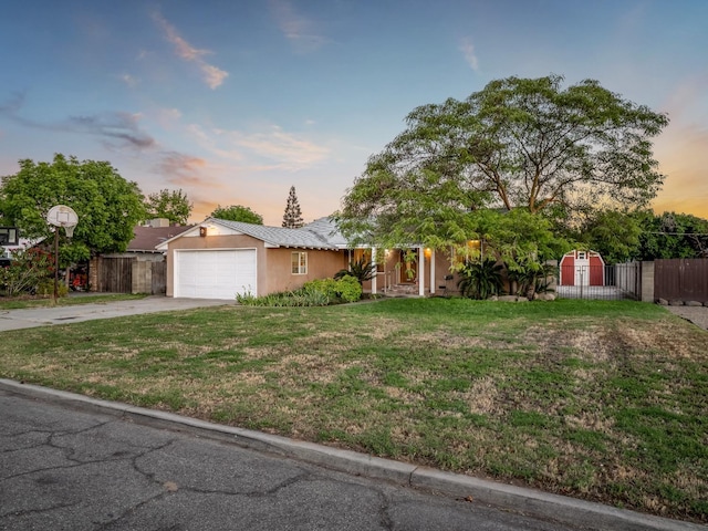 4740 E Princeton Ave, Fresno, CA 93703 - view of front facade with an attached garage, driveway, and stucco siding