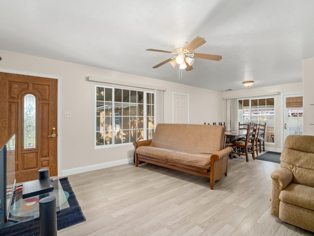 4740 E Princeton Ave, Fresno, CA 93703 - living room featuring ceiling fan, light wood-style floors, and baseboards