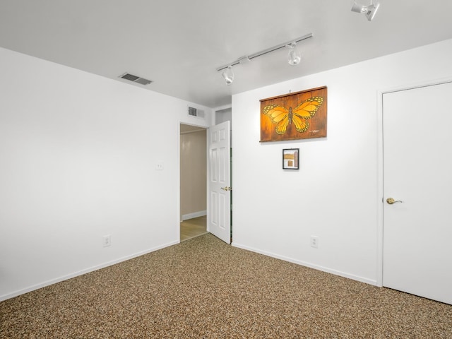 4740 E Princeton Ave, Fresno, CA 93703 - carpeted empty room with track lighting and baseboards