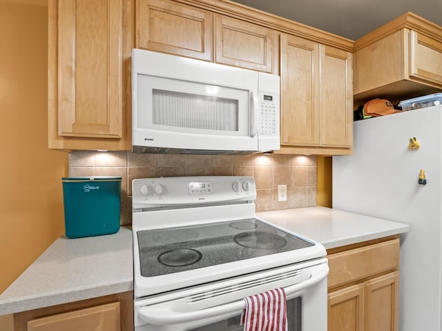 4740 E Princeton Ave, Fresno, CA 93703 - kitchen with white appliances, light brown cabinetry, tasteful backsplash, and light countertops