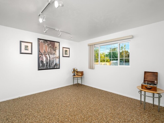 4740 E Princeton Ave, Fresno, CA 93703 - unfurnished room featuring rail lighting and baseboards