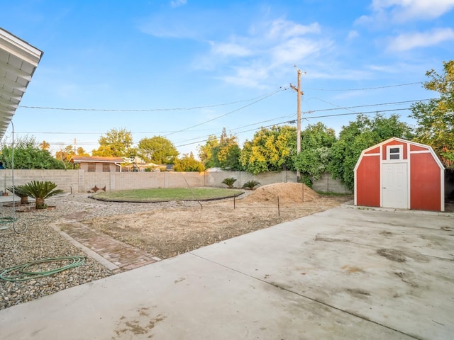 4740 E Princeton Ave, Fresno, CA 93703 - fenced backyard featuring a shed, an outdoor structure, and a patio area