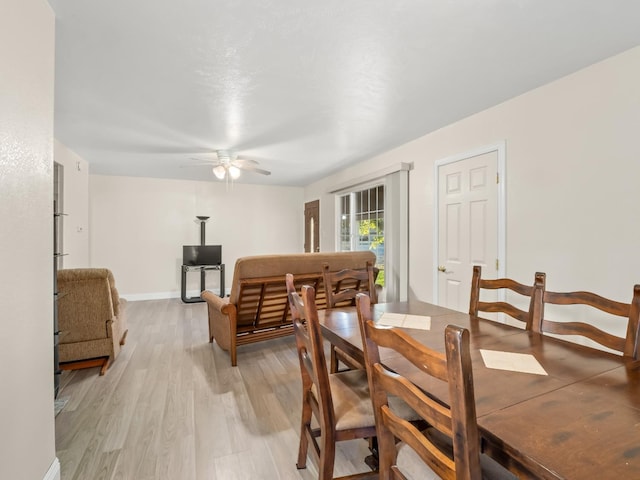 4740 E Princeton Ave, Fresno, CA 93703 - dining room with light wood finished floors, a ceiling fan, and baseboards