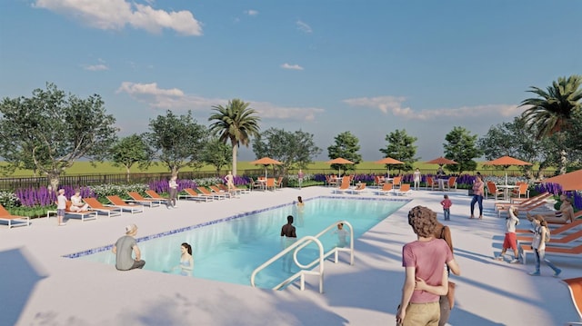 community pool with fence and a patio area