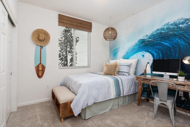 bedroom with carpet flooring and baseboards