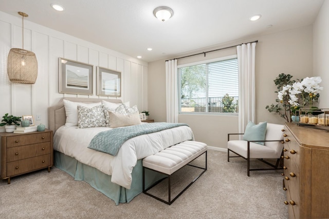bedroom with light carpet, recessed lighting, and baseboards