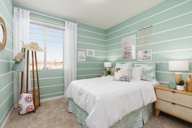 carpeted bedroom featuring baseboards