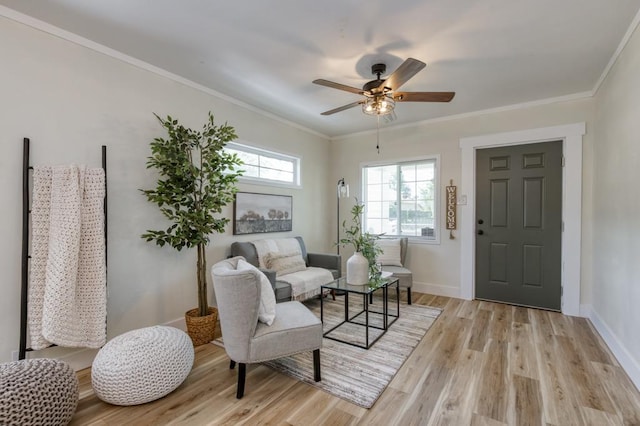 3443 E Washington Ave, Fresno, CA 93702 - sitting room with light wood-style flooring, ceiling fan, baseboards, and ornamental molding