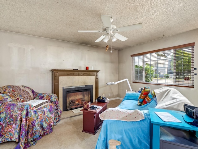 2204 Peach Ave Unit 1, Clovis, CA 93612 - bedroom featuring a textured ceiling, a fireplace, and a ceiling fan