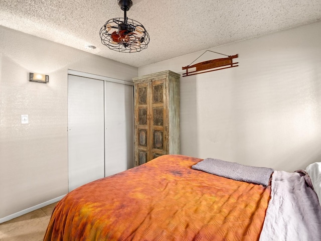 2204 Peach Ave Unit 1, Clovis, CA 93612 - bedroom featuring a closet, a textured ceiling, and baseboards
