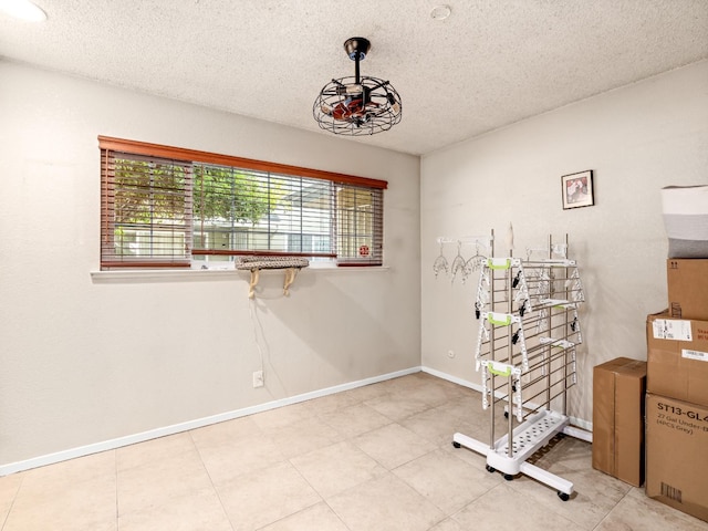 2204 Peach Ave Unit 1, Clovis, CA 93612 - misc room with a textured ceiling and baseboards