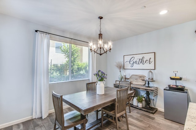 3877 Griffith Ave, Clovis, CA 93619 - dining room featuring a chandelier, light wood-style flooring, baseboards, and recessed lighting