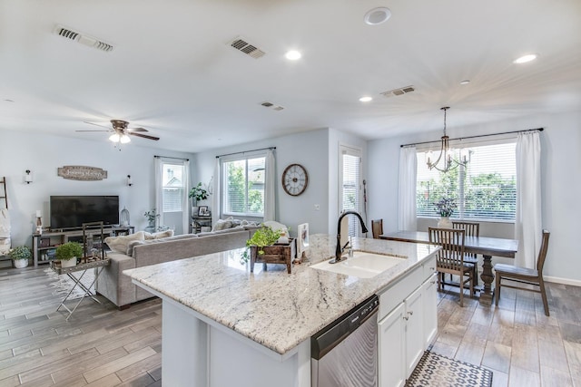 3877 Griffith Ave, Clovis, CA 93619 - kitchen featuring stainless steel dishwasher, a sink, light wood-style flooring, recessed lighting, and white cabinetry