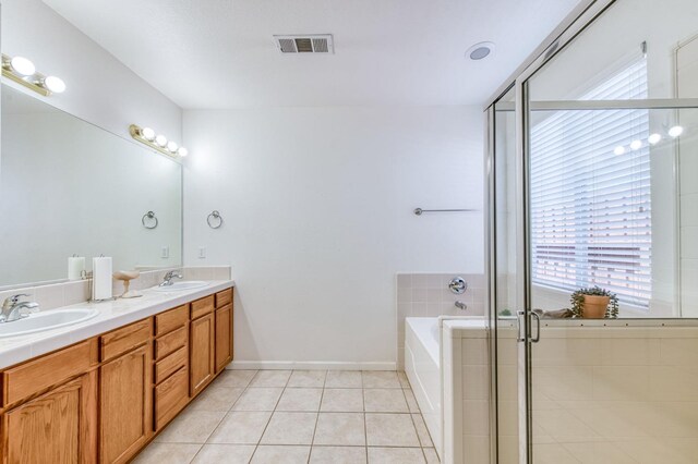 947 Carson Ave, Clovis, CA 93611 - full bath featuring healthy amount of natural light, double vanity, tile patterned flooring, and a shower stall