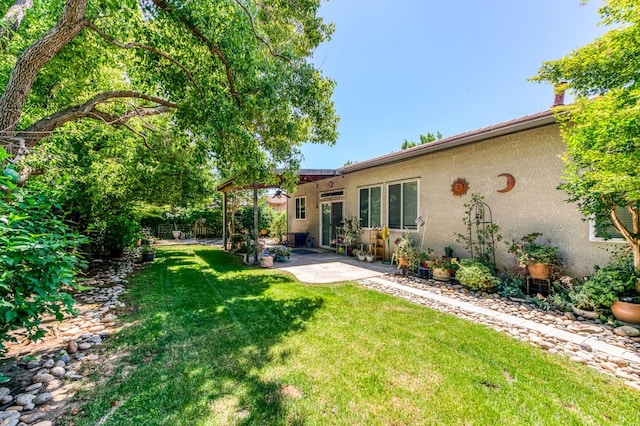 947 Carson Ave, Clovis, CA 93611 - rear view of house with a patio area and stucco siding