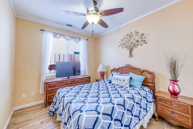 947 Carson Ave, Clovis, CA 93611 - bedroom with light wood finished floors, ornamental molding, baseboards, and ceiling fan
