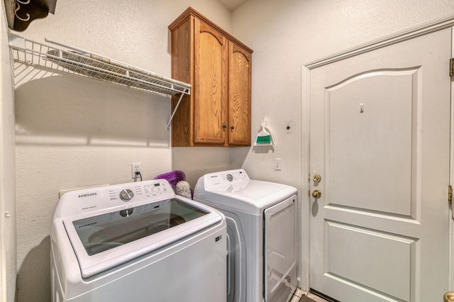 947 Carson Ave, Clovis, CA 93611 - washroom featuring separate washer and dryer, cabinet space, and a textured wall