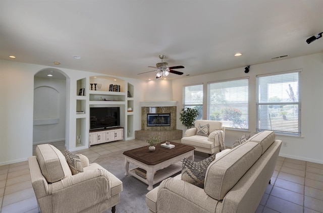 30925 Pennyroyal Ln, Prather, CA 93651 - living area with light tile patterned floors, a ceiling fan, built in shelves, plenty of natural light, and recessed lighting