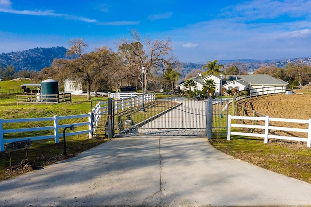 30925 Pennyroyal Ln, Prather, CA 93651 - gate with fence, a view of rural / pastoral area, and a mountain view