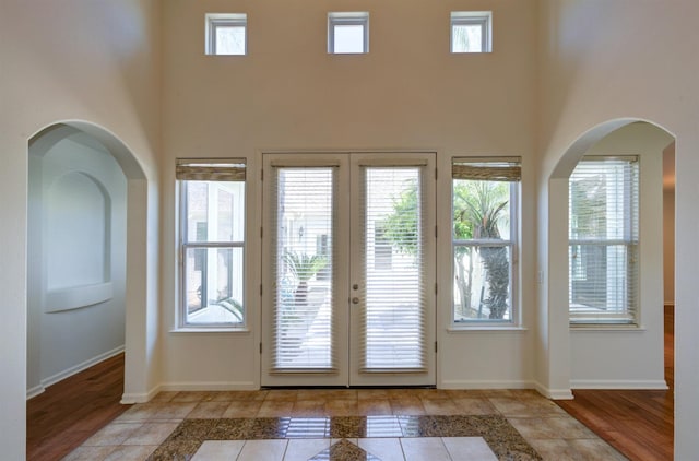 30925 Pennyroyal Ln, Prather, CA 93651 - entryway featuring french doors, a towering ceiling, and baseboards