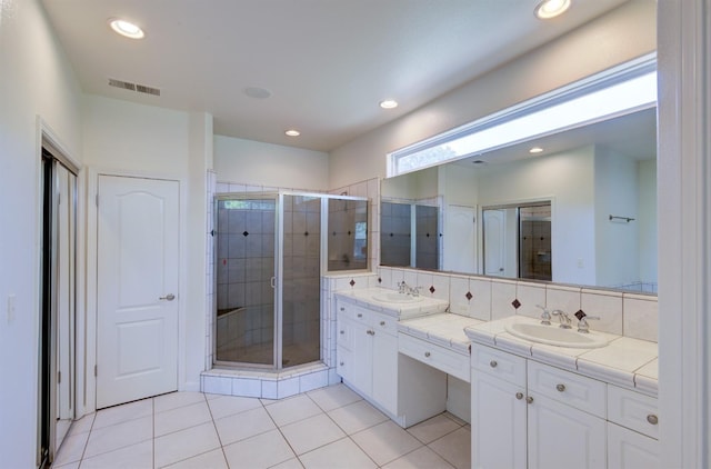 30925 Pennyroyal Ln, Prather, CA 93651 - bathroom with tile patterned floors, a shower stall, double vanity, and recessed lighting