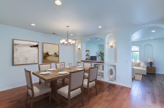 30925 Pennyroyal Ln, Prather, CA 93651 - dining room featuring recessed lighting, arched walkways, wood finished floors, a chandelier, and baseboards