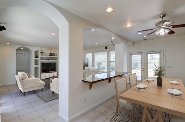 30925 Pennyroyal Ln, Prather, CA 93651 - dining area featuring light tile patterned floors, arched walkways, plenty of natural light, and recessed lighting