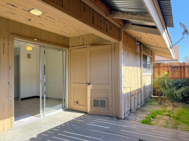 doorway to property with fence