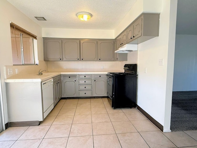 kitchen with black range with electric stovetop, white dishwasher, gray cabinetry, under cabinet range hood, and a sink