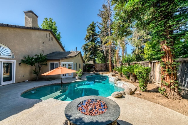 view of swimming pool with a patio and a fenced backyard