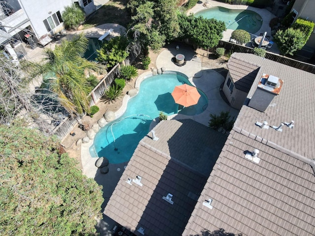 aerial view of property's location with a pool