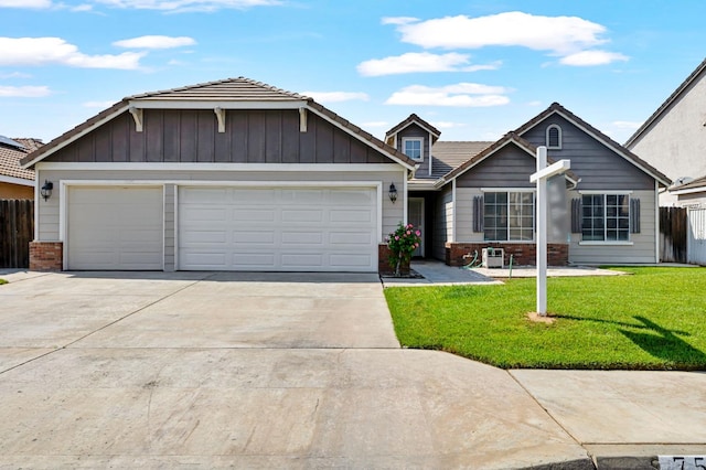 view of front of home with concrete driveway, brick siding, and an attached garage