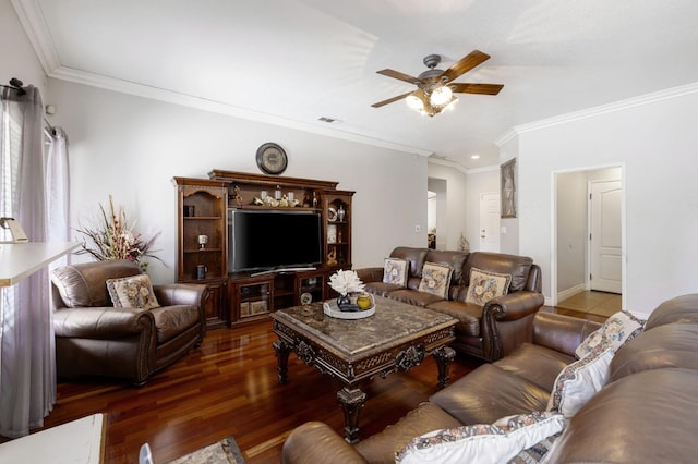living room with a ceiling fan, ornamental molding, wood finished floors, and baseboards