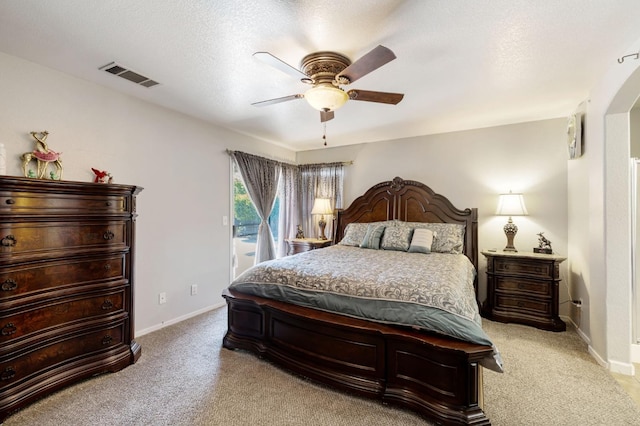 bedroom with carpet, access to exterior, arched walkways, baseboards, and ceiling fan