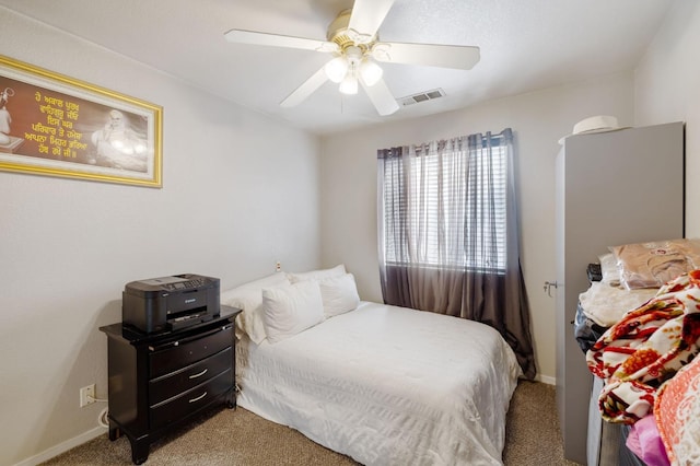 carpeted bedroom with baseboards and ceiling fan