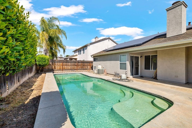 view of swimming pool featuring a fenced backyard, a patio area, and cooling unit