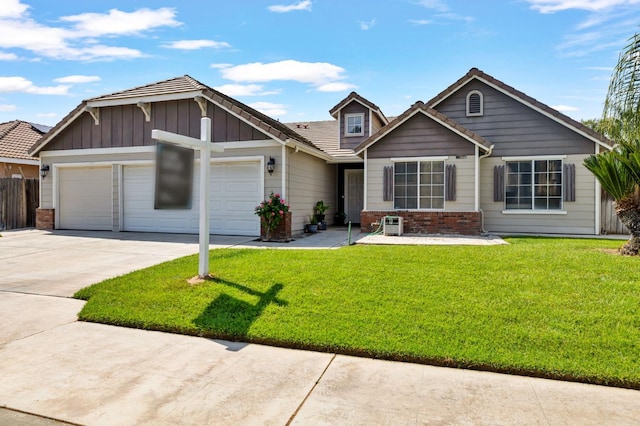 single story home featuring driveway, an attached garage, brick siding, and board and batten siding
