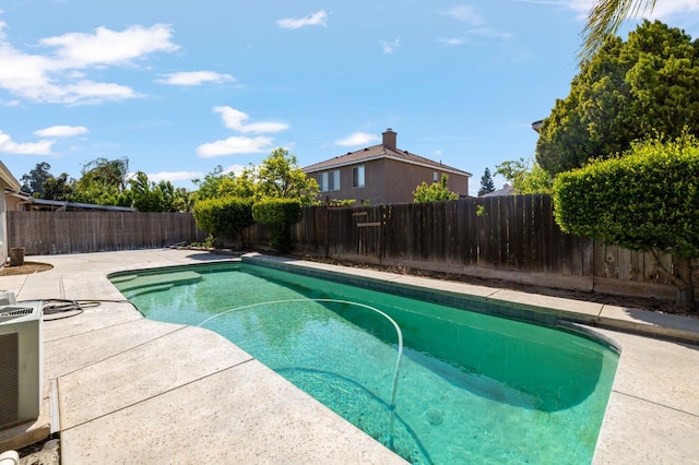 view of swimming pool featuring a patio area and a fenced backyard