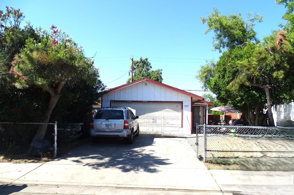 2257 Webster, Fresno, CA 93701 - ranch-style house with fence, an outbuilding, and a detached garage