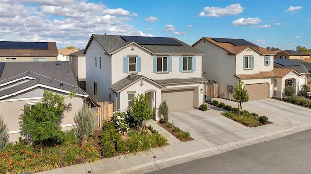 841 Corazon Ave, Clovis, CA 93619 - view of front of home with stucco siding, an attached garage, a residential view, driveway, and solar panels