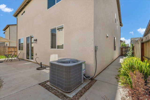 841 Corazon Ave, Clovis, CA 93619 - back of property featuring a patio area, stucco siding, and a fenced backyard