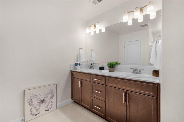 841 Corazon Ave, Clovis, CA 93619 - bathroom with double vanity and tile patterned floors