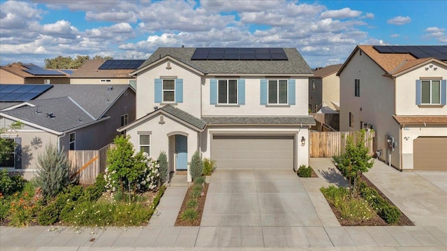841 Corazon Ave, Clovis, CA 93619 - traditional home with stucco siding, driveway, an attached garage, solar panels, and a shingled roof
