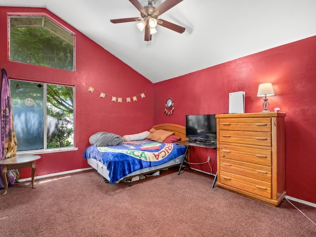 bedroom with vaulted ceiling, carpet floors, ceiling fan, and a textured wall