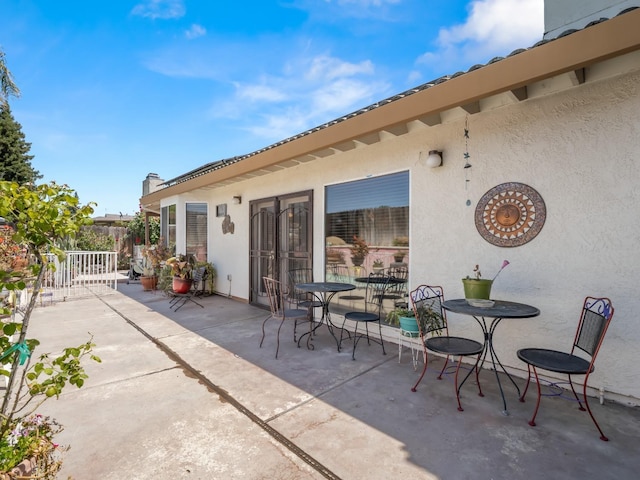 view of patio / terrace featuring fence