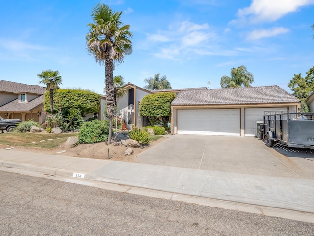 view of front of house featuring stucco siding, a garage, and concrete driveway