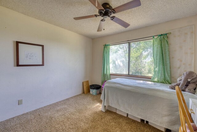 28302 Tollhouse Rd, Tollhouse, CA 93667 - carpeted bedroom with a textured ceiling and a ceiling fan