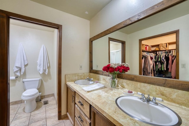 28302 Tollhouse Rd, Tollhouse, CA 93667 - bathroom with toilet, double vanity, tile patterned floors, a walk in closet, and an enclosed shower